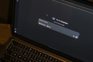 laptop displaying ai chat interface at night
