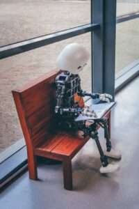 robot sitting on bench